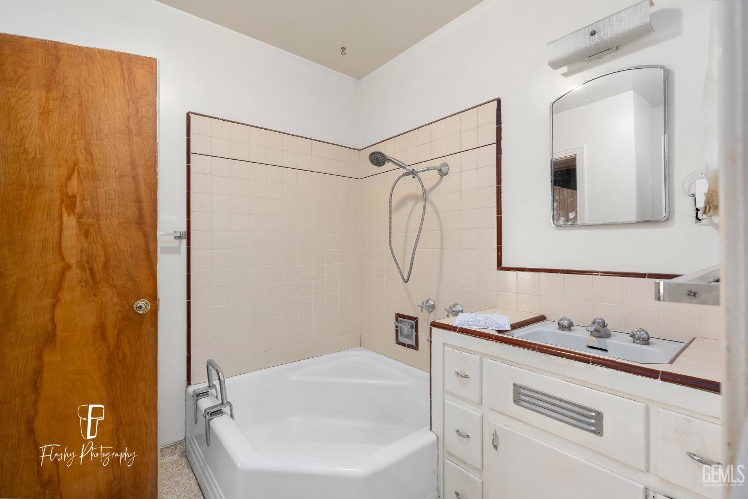 Undisclosed Address Bakersfield, CA 93304 - Photo 26 of 38 a bathroom with a sink and a bathtub