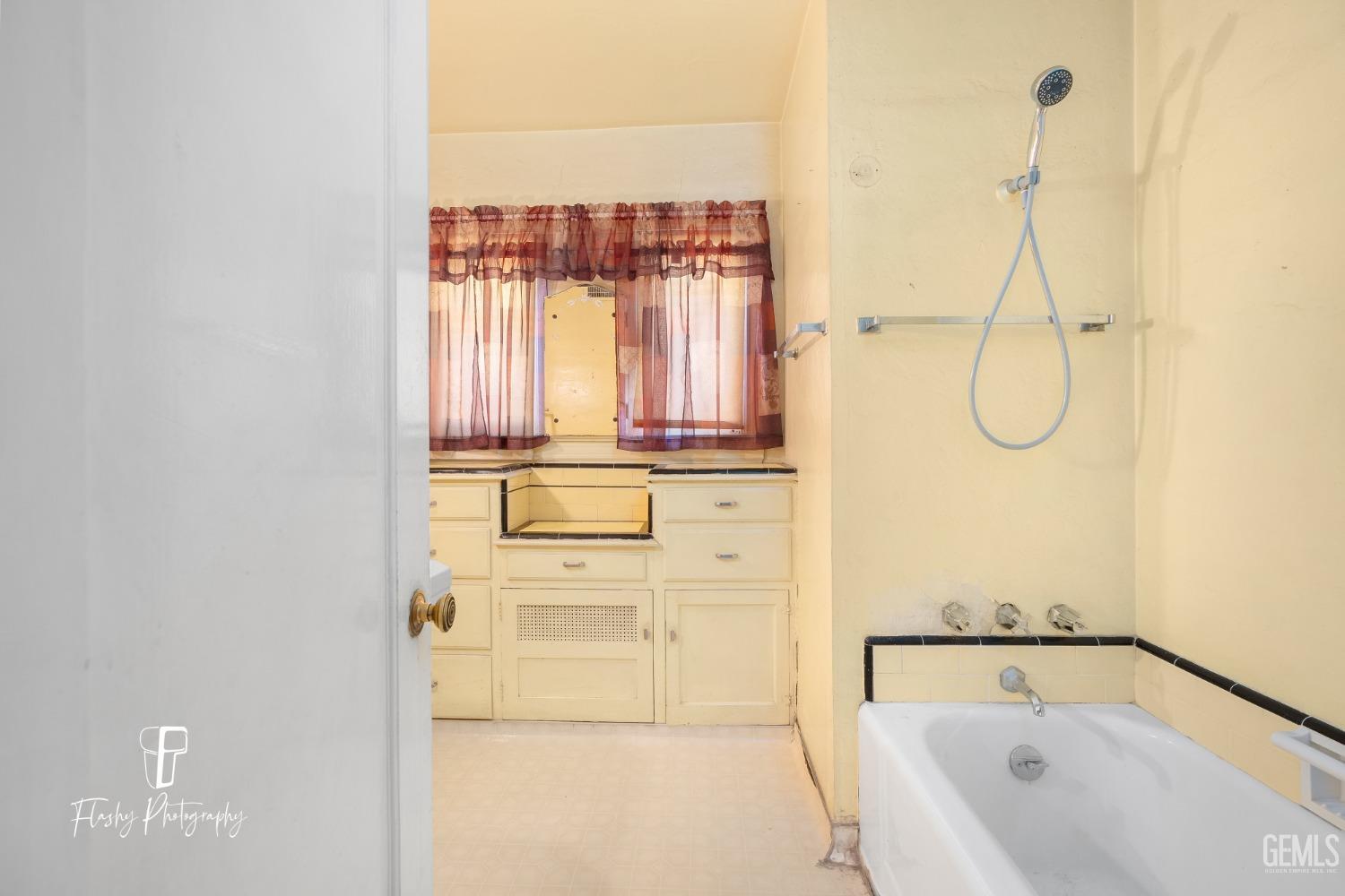 Undisclosed Address Bakersfield, CA 93304 - Photo 28 of 38 a bathroom with a bathtub and a shower