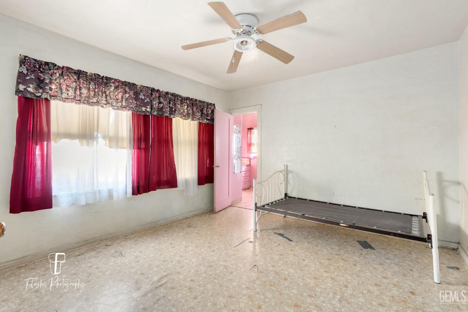 Undisclosed Address Bakersfield, CA 93304 - Photo 33 of 38 a view of a room with window and a ceiling fan