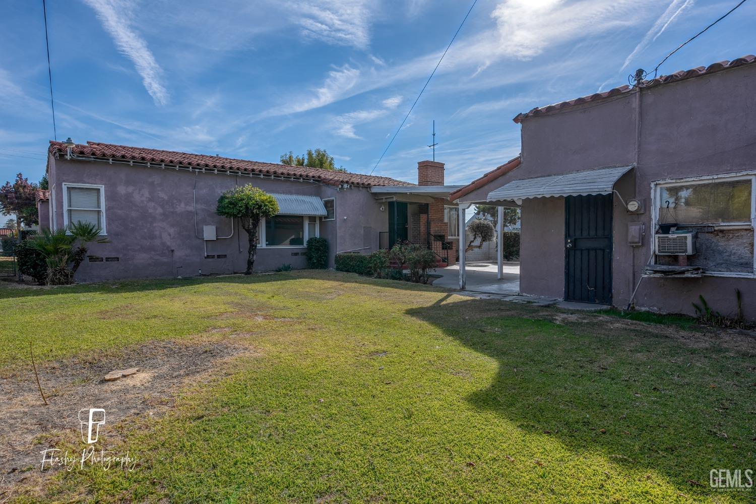 Undisclosed Address Bakersfield, CA 93304 - Photo 6 of 38 a front view of house with yard and outdoor seating