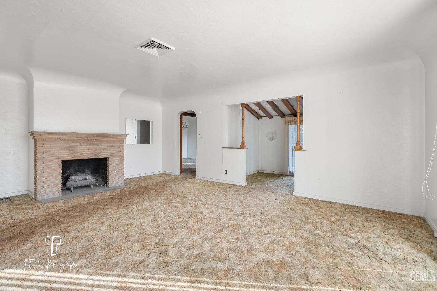 Undisclosed Address Bakersfield, CA 93304 - Photo 10 of 38 a view of empty room with a fireplace