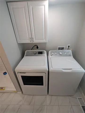 a utility room with dryer and washer