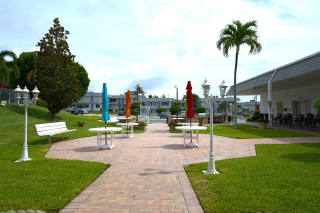a view of a park with swings and slides
