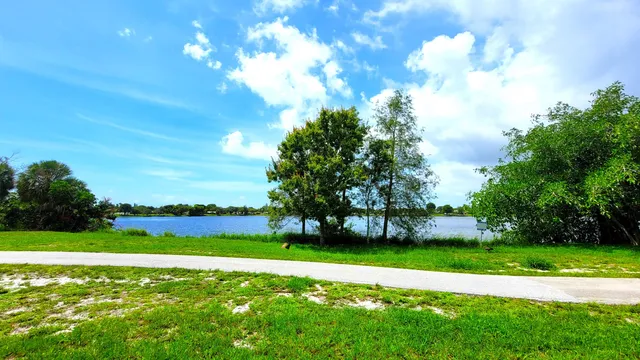 a view of a golf course with a lake