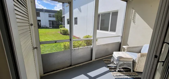 a view of an entryway with sitting area