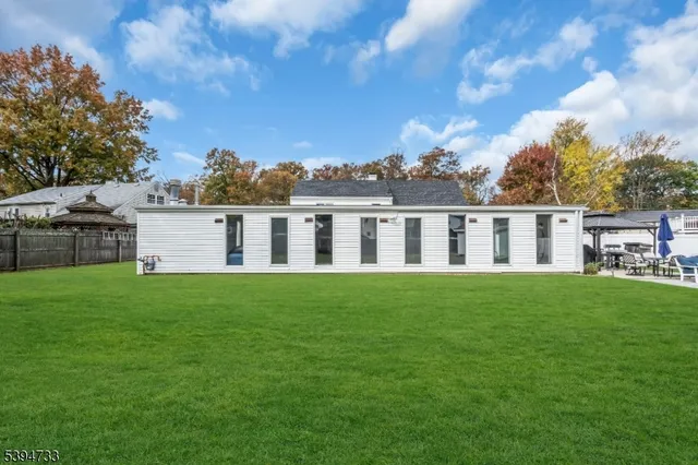 a view of house with backyard
