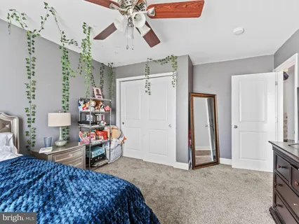 a bed room with a bed and a chandelier