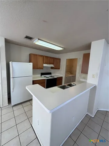 a utility room with washer and dryer