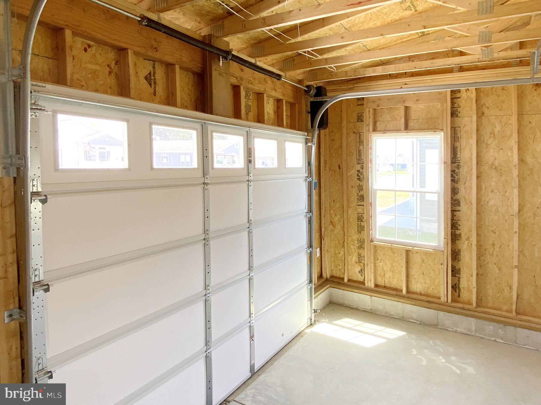 12 Carlisle Way Lewes, DE 19958 - Photo 23 of 25 Bright and spacious garage interior.