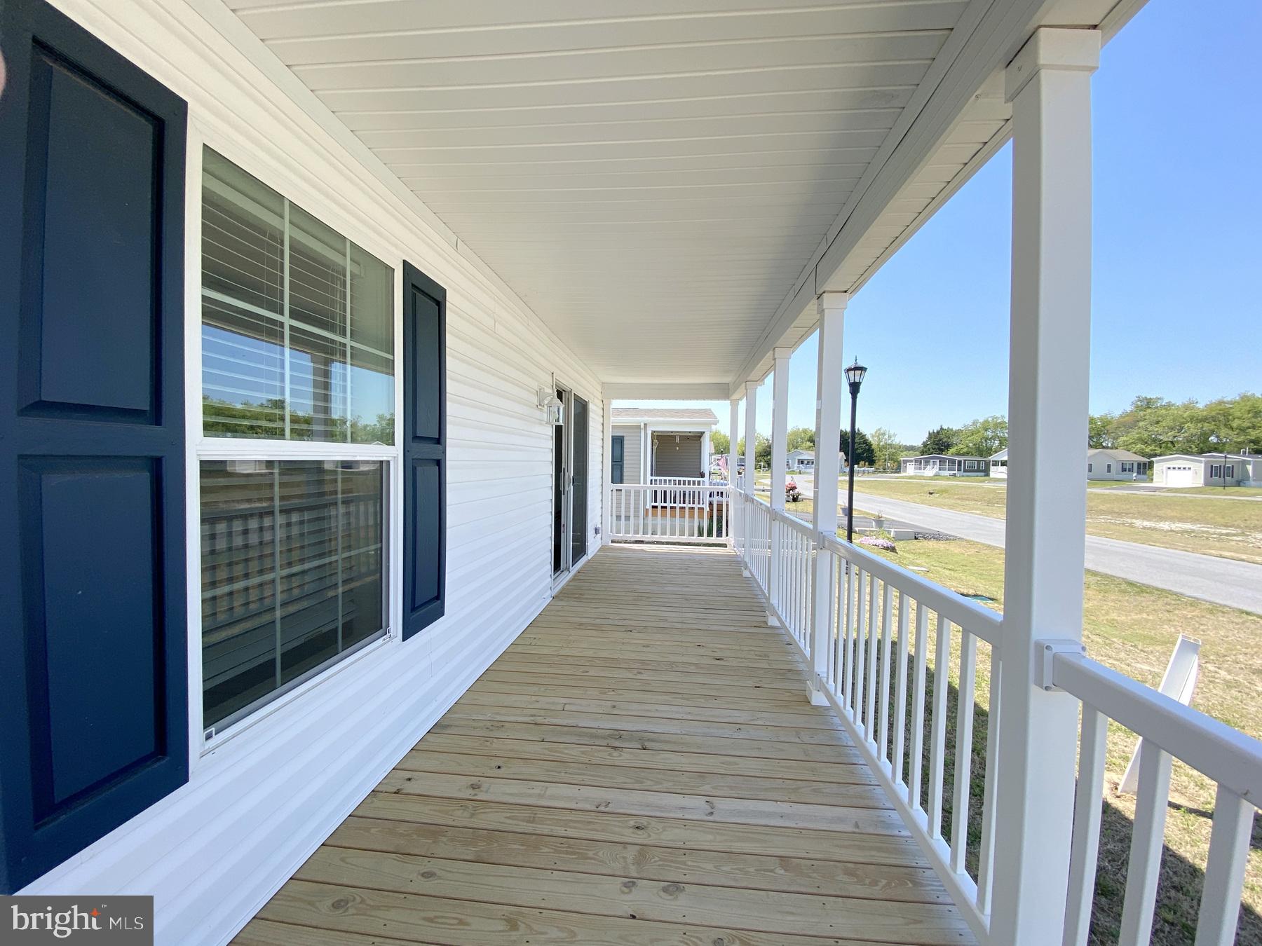 12 Carlisle Way Lewes, DE 19958 - Photo 4 of 25 Charming porch with inviting views.