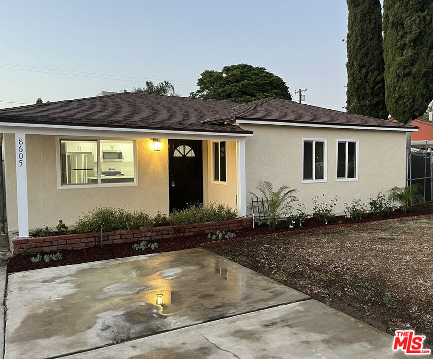 8605 Penny Drive Riverside, CA 92503 - Photo 1 of 22 a front view of a house with a yard