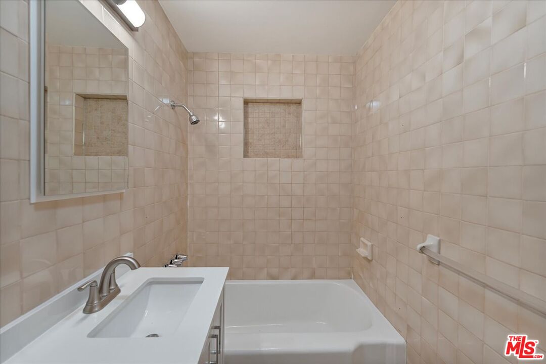 8605 Penny Drive Riverside, CA 92503 - Photo 12 of 22 a bathroom with a sink and a bathtub
