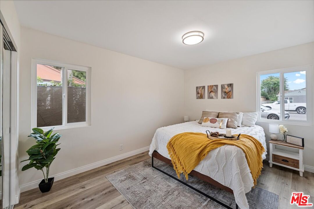 8605 Penny Drive Riverside, CA 92503 - Photo 13 of 22 a bedroom with bed and a window