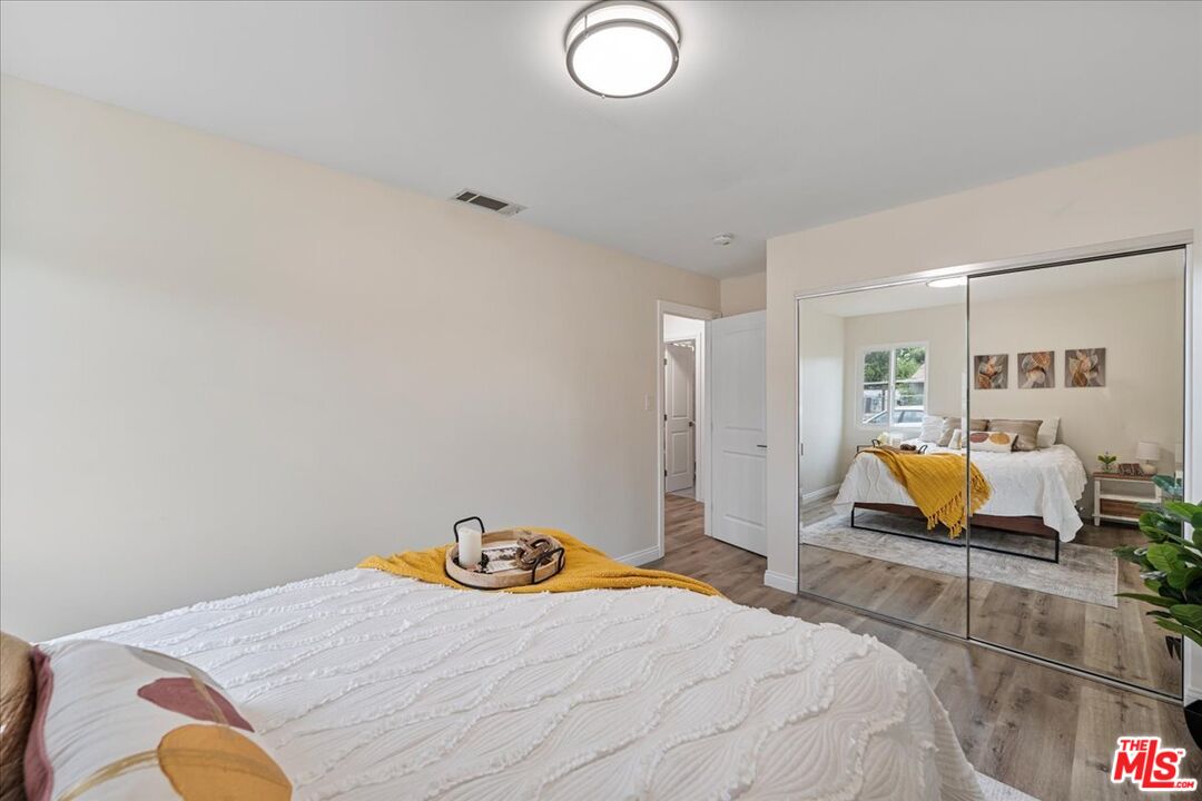 8605 Penny Drive Riverside, CA 92503 - Photo 14 of 22 a bedroom with a bed and couch