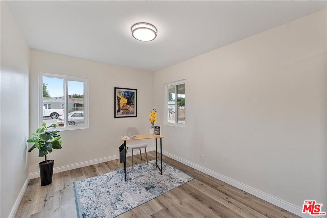 8605 Penny Drive Riverside, CA 92503 - Photo 15 of 22 a living room with furniture and a potted plant