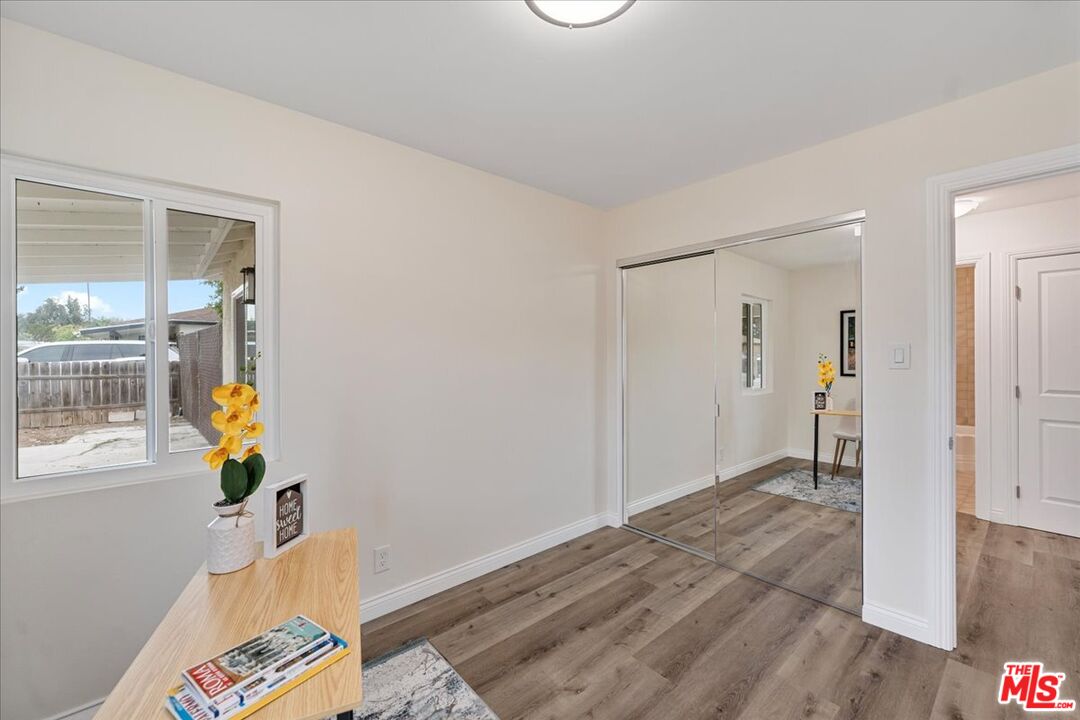 8605 Penny Drive Riverside, CA 92503 - Photo 16 of 22 a bedroom with a bed and a window