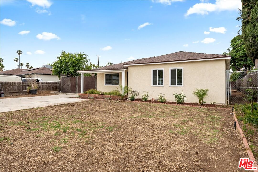 8605 Penny Drive Riverside, CA 92503 - Photo 2 of 22 a front view of a house with garden