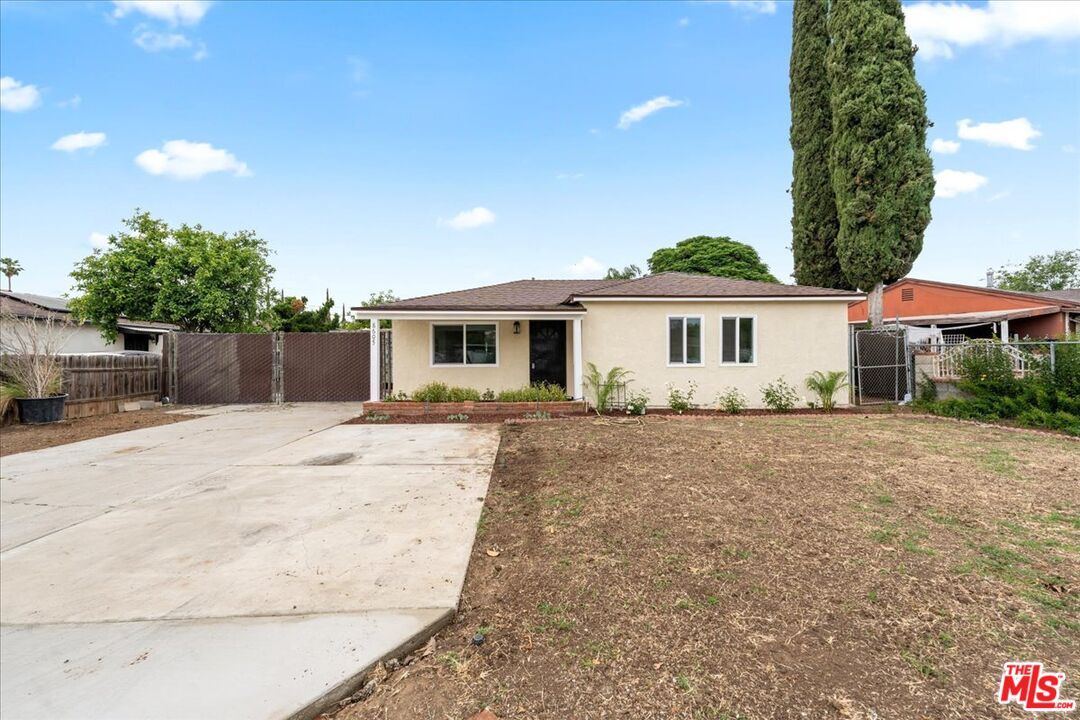 8605 Penny Drive Riverside, CA 92503 - Photo 3 of 22 a view of a house with a yard and sitting area