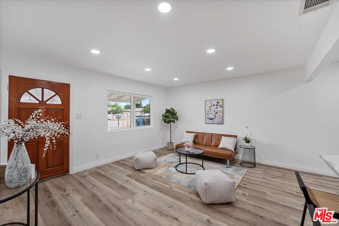 8605 Penny Drive Riverside, CA 92503 - Photo 4 of 22 a living room with furniture and wooden floor