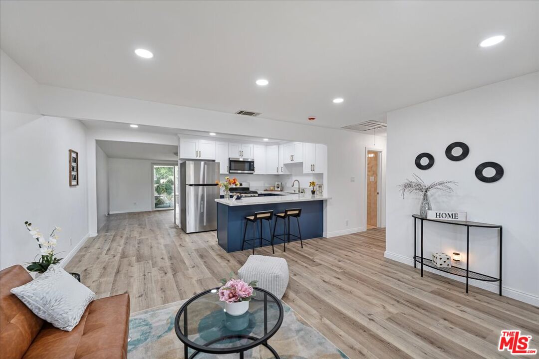 8605 Penny Drive Riverside, CA 92503 - Photo 5 of 22 a living room with furniture and kitchen view