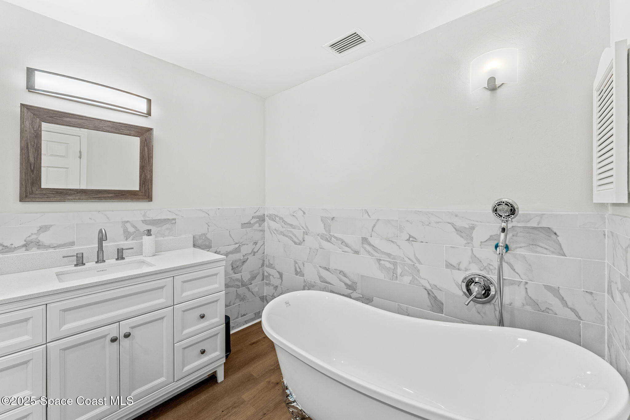3037 S Highway, Unit 3C Melbourne Beach, FL 32951 - Photo 26 of 52 a bathroom with a bathtub and a sink