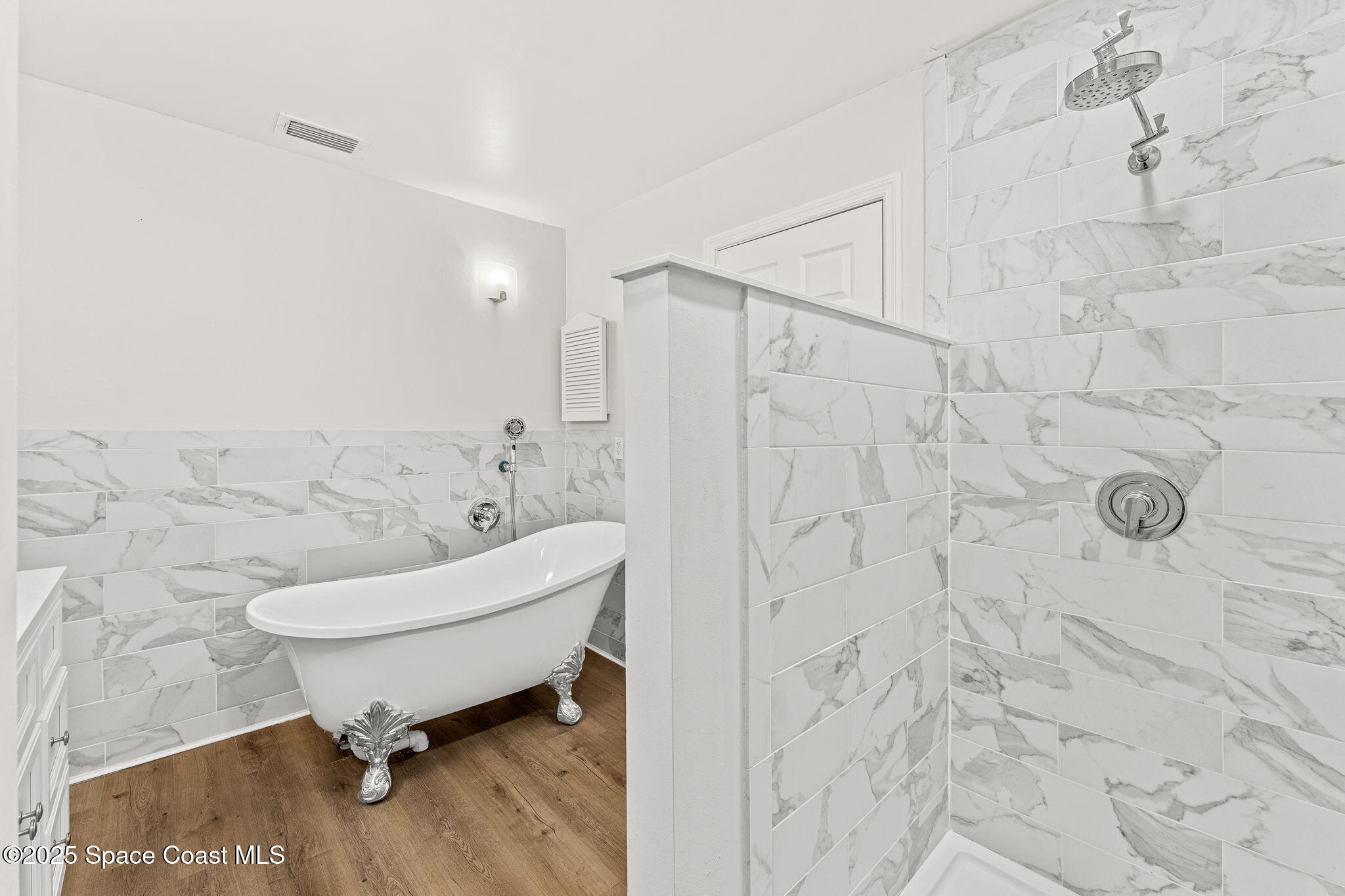 3037 S Highway, Unit 3C Melbourne Beach, FL 32951 - Photo 27 of 52 a bathroom with a toilet sink and shower