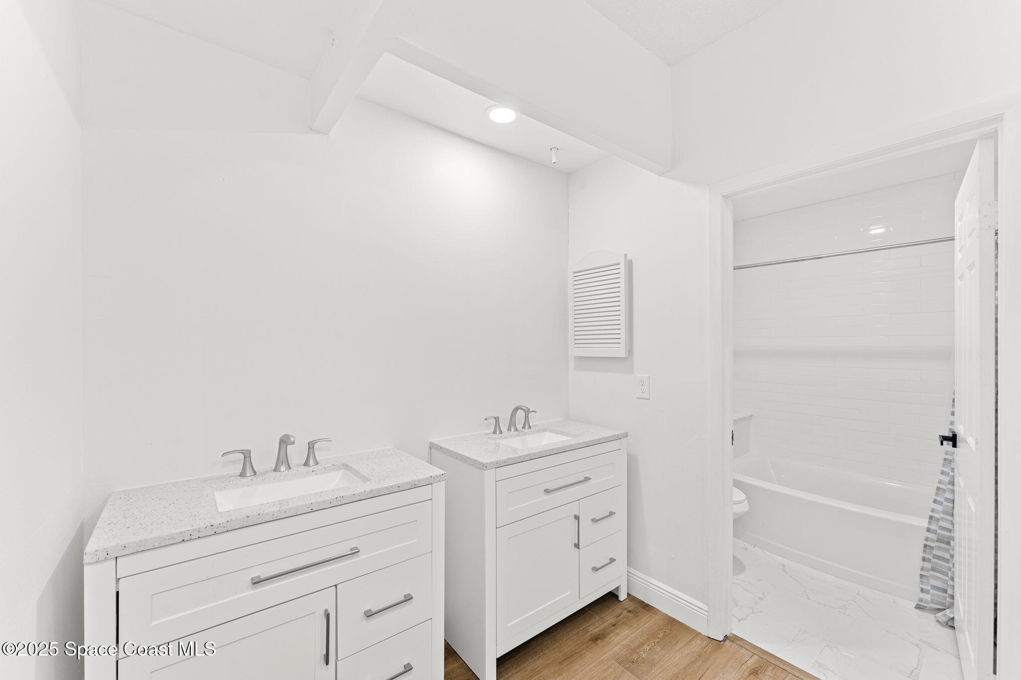 3037 S Highway, Unit 3C Melbourne Beach, FL 32951 - Photo 29 of 52 a bathroom with a granite countertop sink mirror and a