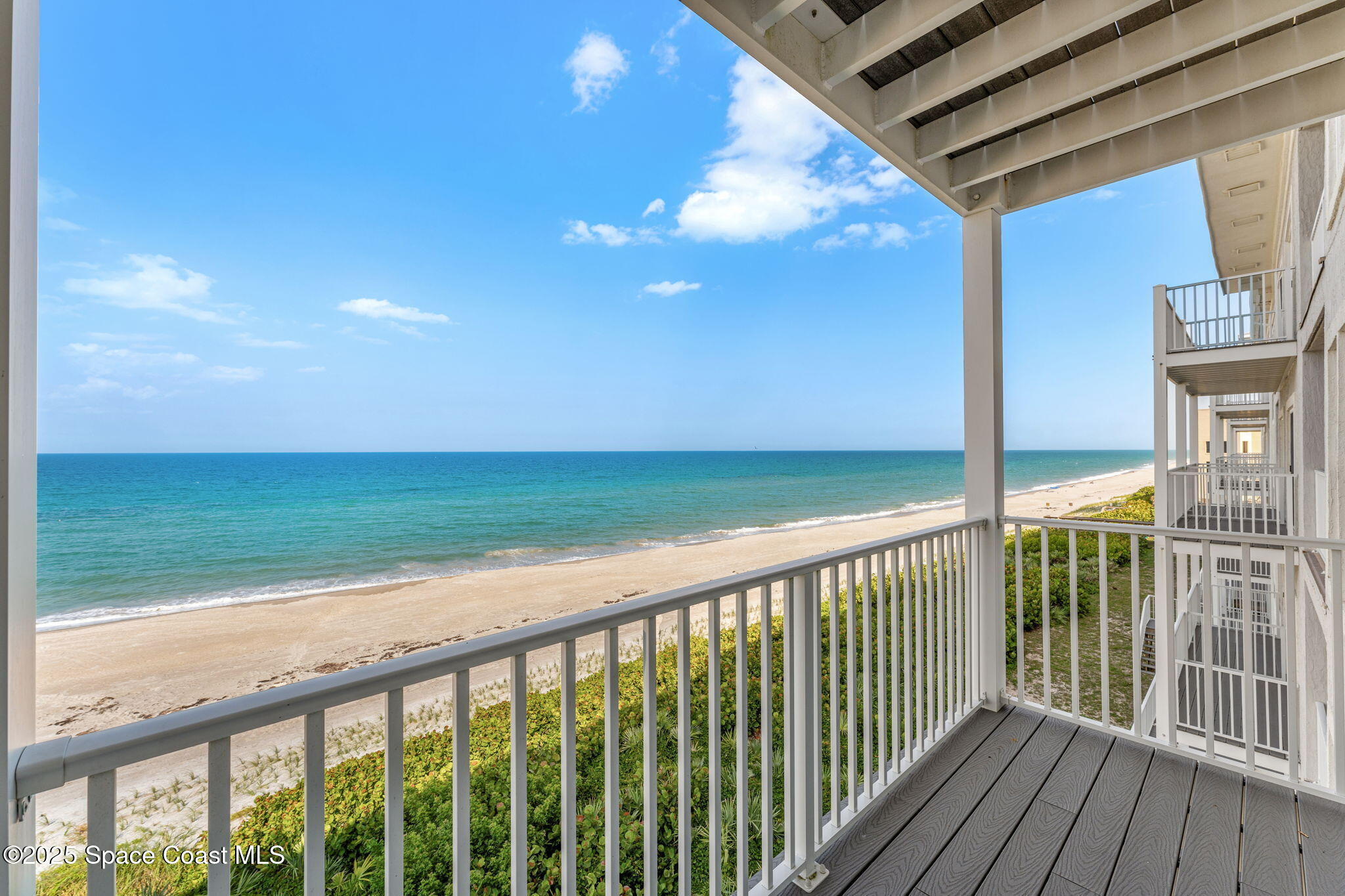 3037 S Highway, Unit 3C Melbourne Beach, FL 32951 - Photo 31 of 52 a view of a balcony with an ocean view