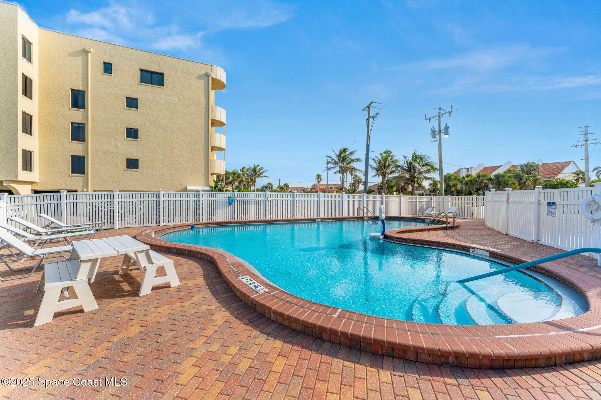 3037 S Highway, Unit 3C Melbourne Beach, FL 32951 - Photo 36 of 52 a view of a swimming pool with a terrace