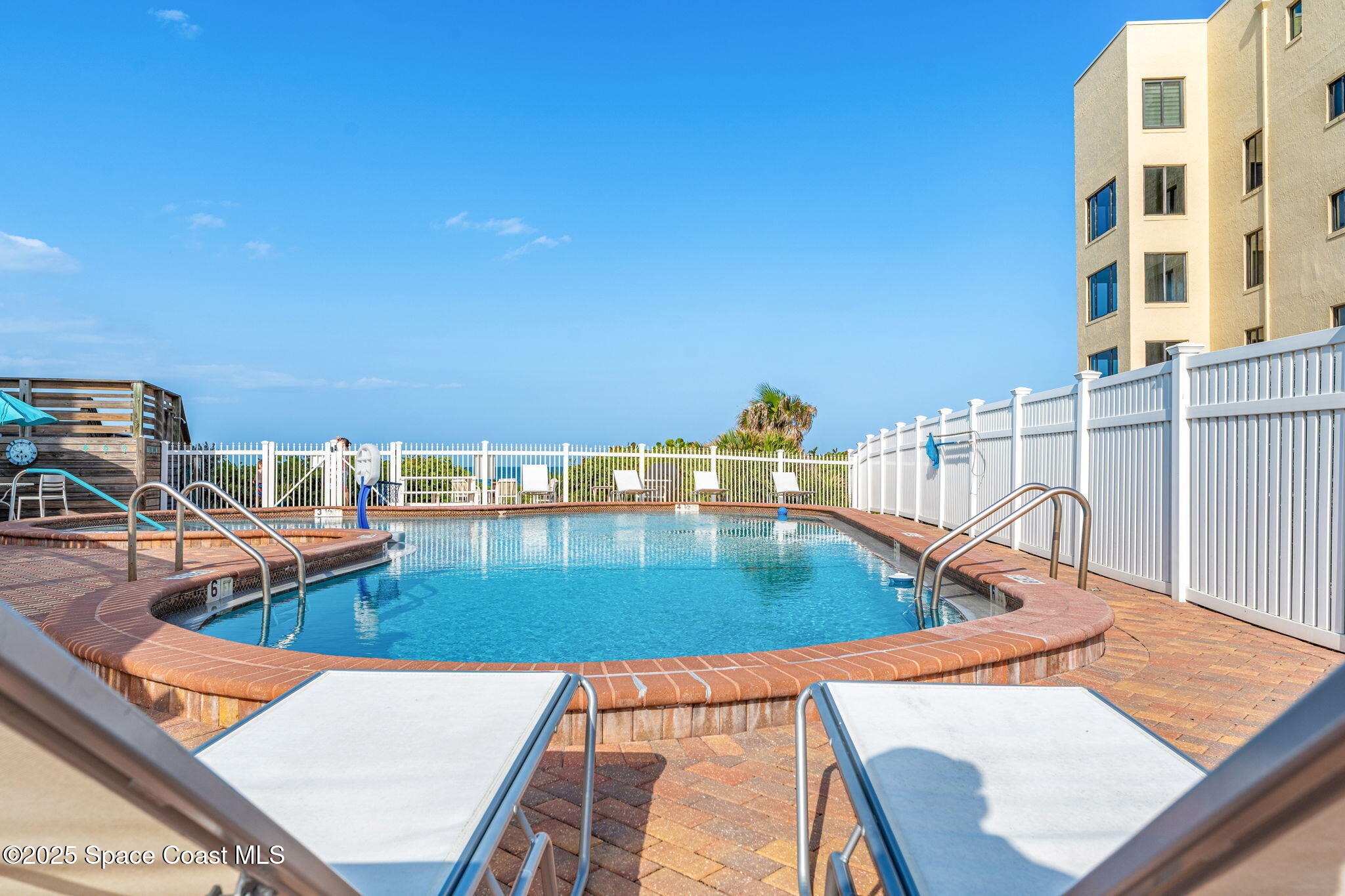 3037 S Highway, Unit 3C Melbourne Beach, FL 32951 - Photo 37 of 52 swimming pool view with a outdoor space