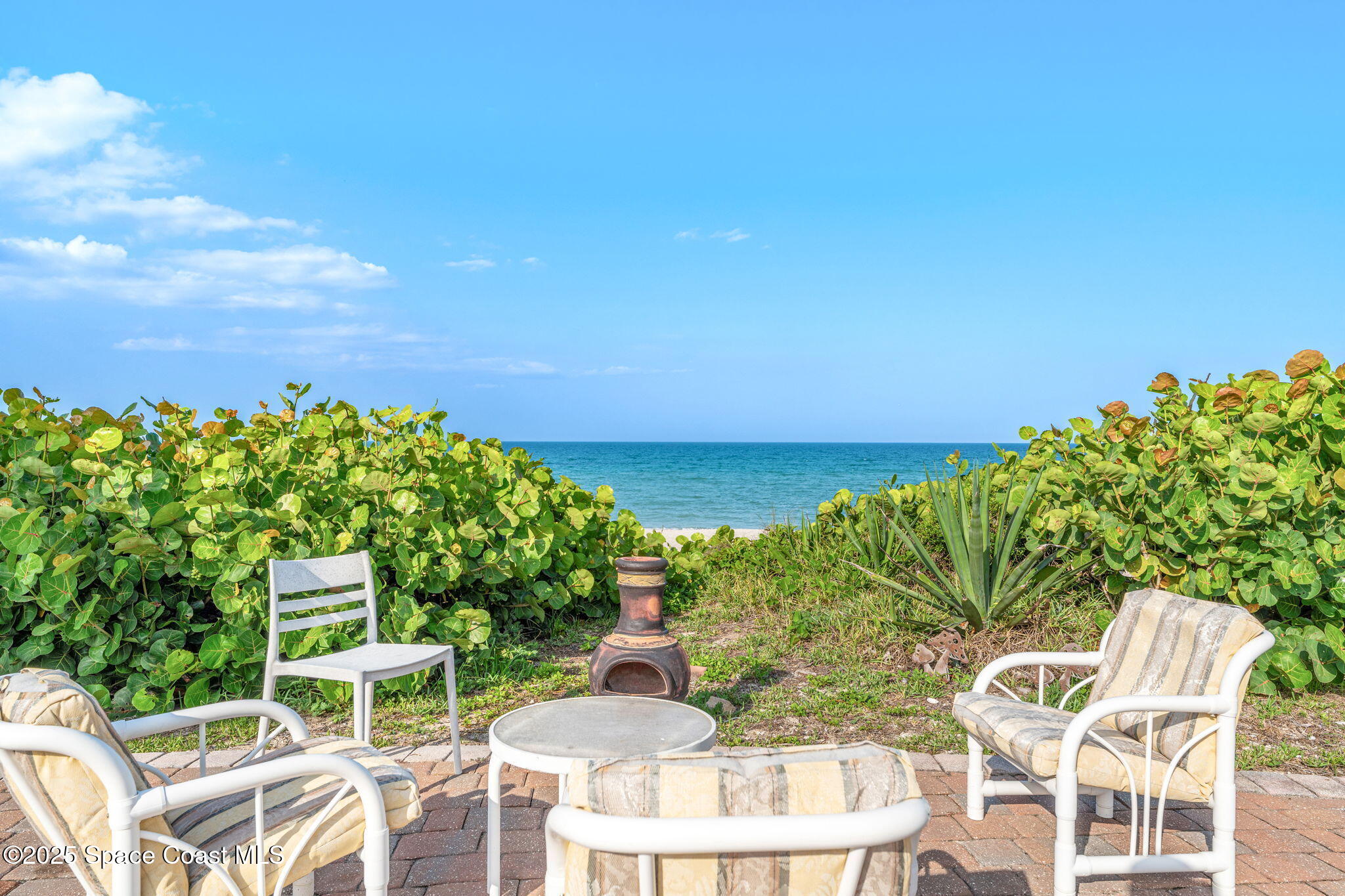 3037 S Highway, Unit 3C Melbourne Beach, FL 32951 - Photo 39 of 52 a view of an chairs and table in the patio