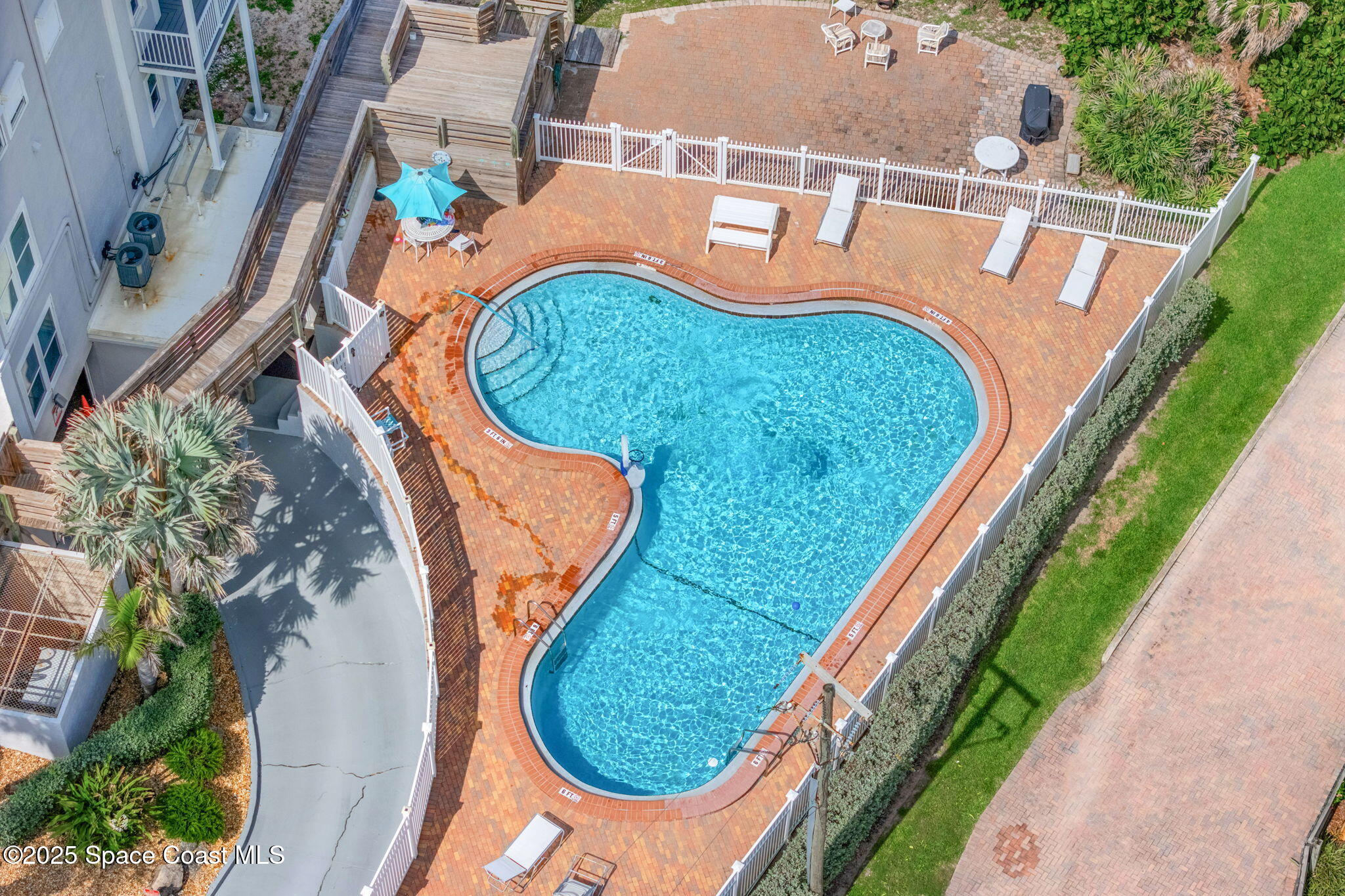 3037 S Highway, Unit 3C Melbourne Beach, FL 32951 - Photo 43 of 52 an aerial view of a house with a swimming pool