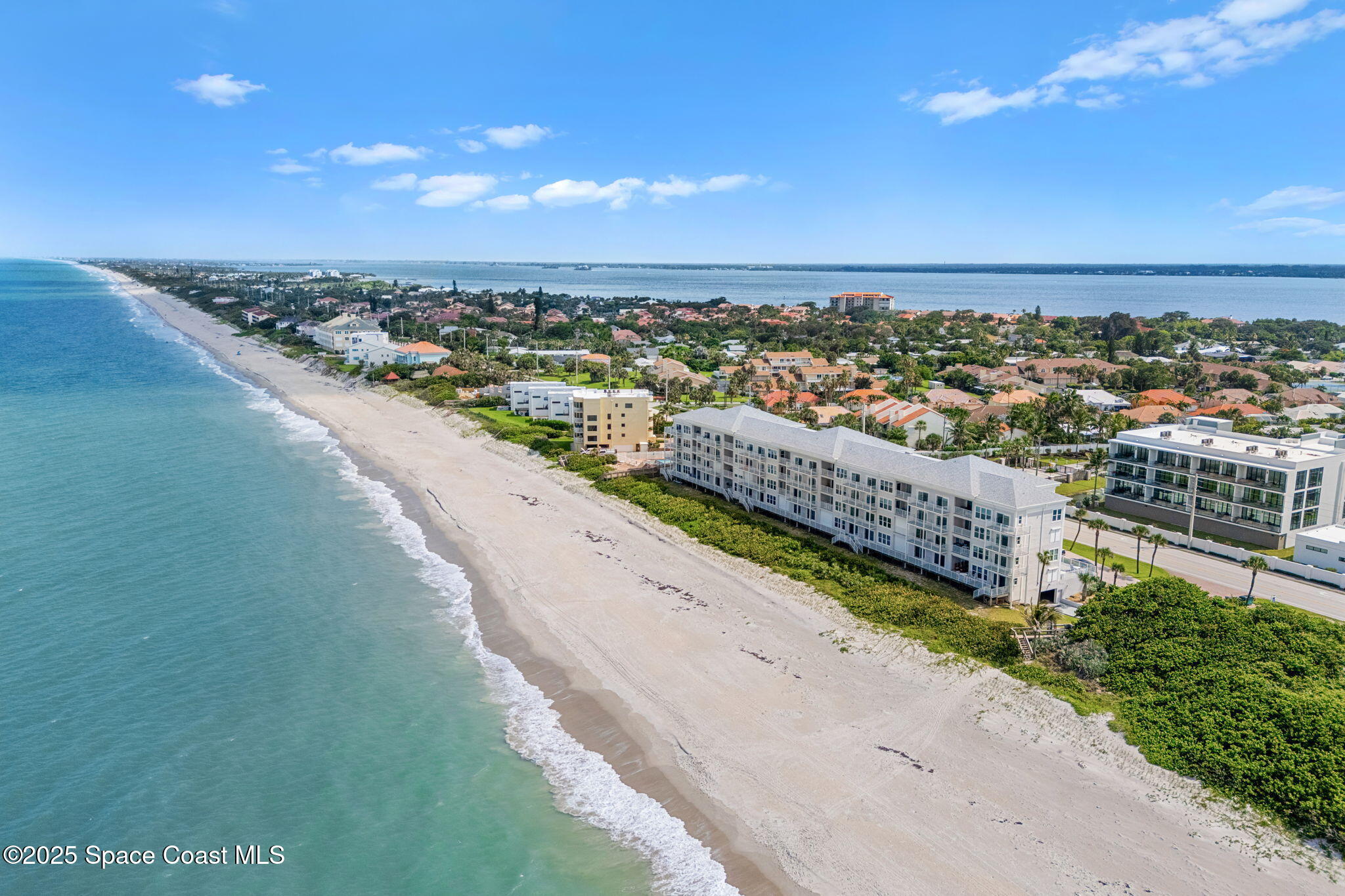 3037 S Highway, Unit 3C Melbourne Beach, FL 32951 - Photo 48 of 52 a view of a city skyline from a terrace