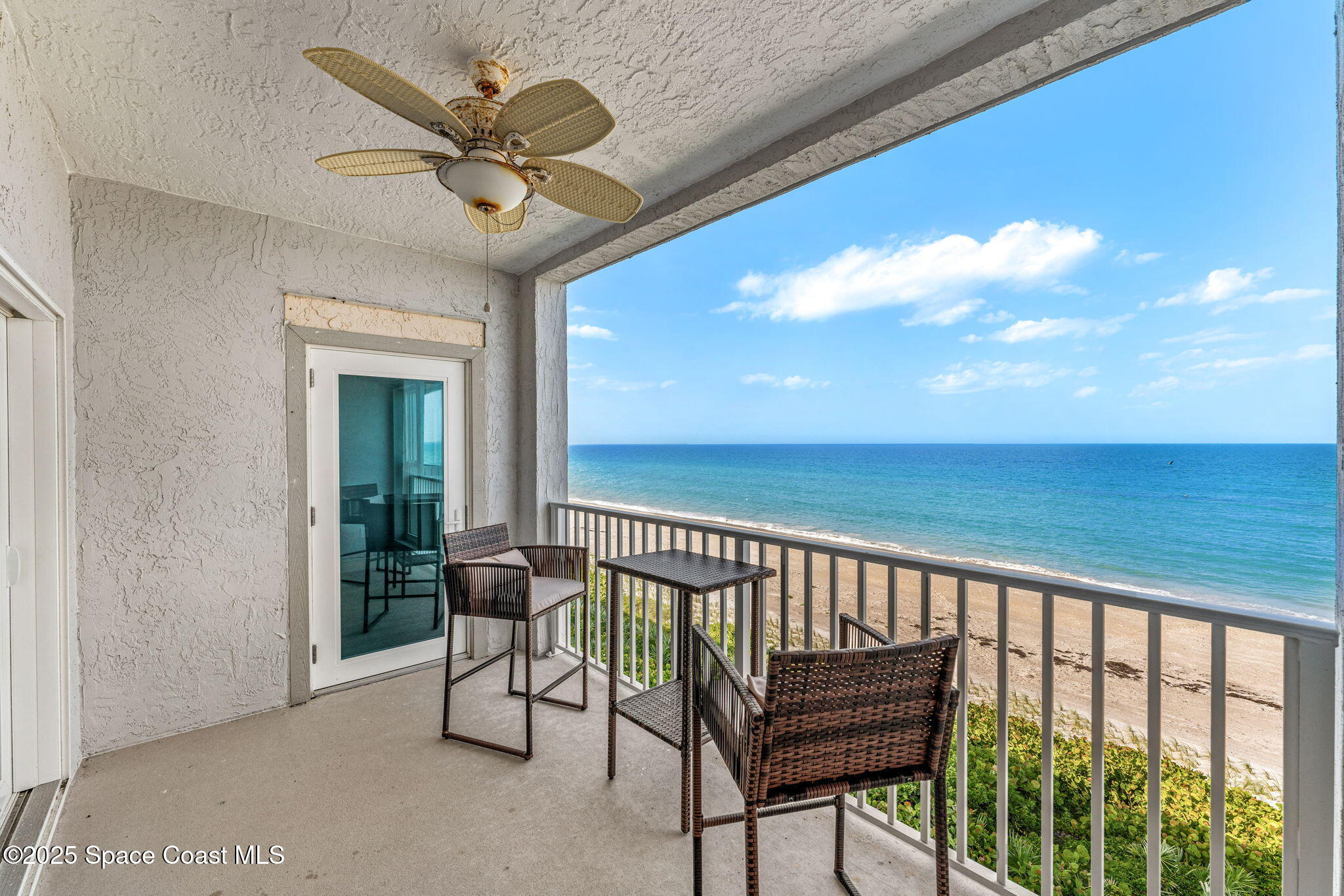 3037 S Highway, Unit 3C Melbourne Beach, FL 32951 - Photo 6 of 52 a view of a balcony with furniture