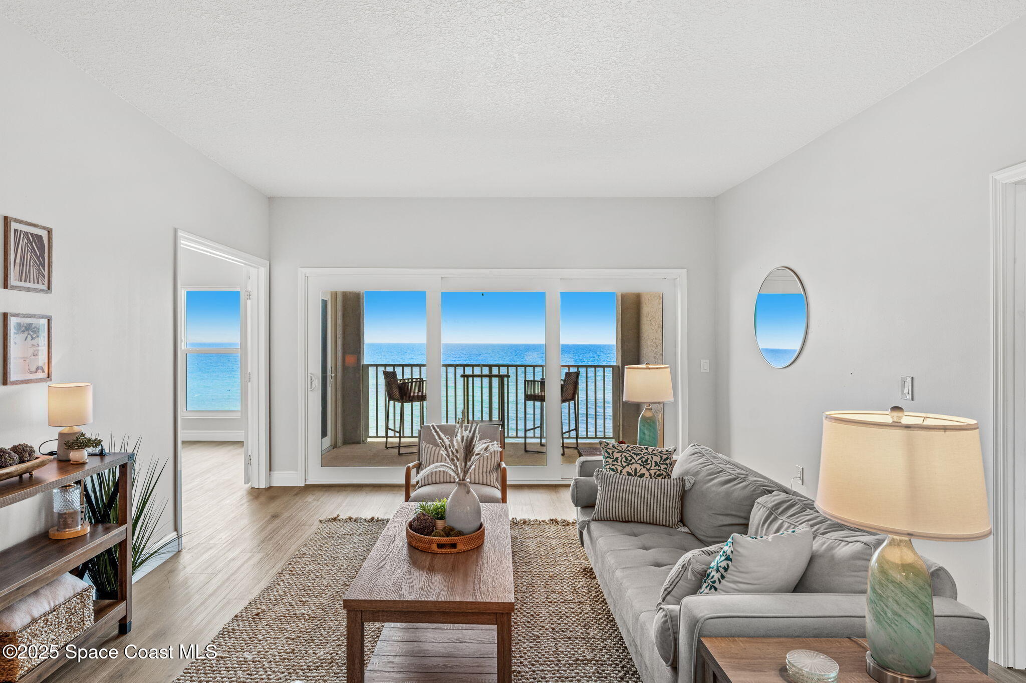 3037 S Highway, Unit 3C Melbourne Beach, FL 32951 - Photo 9 of 52 a living room with furniture and a flat screen tv