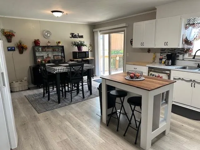 a view of living room with furniture and a flat screen tv