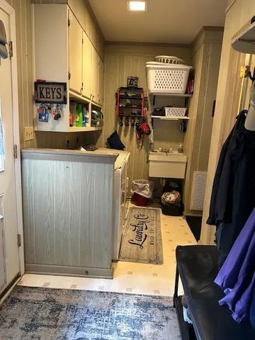 a view of a livingroom with furniture and a flat screen tv