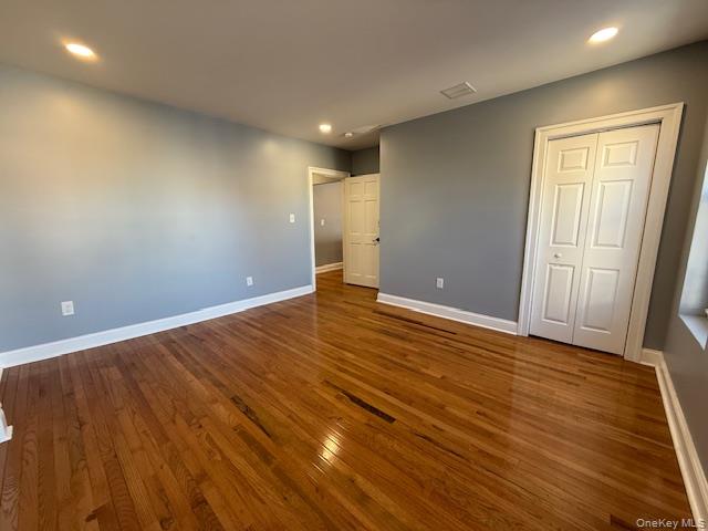 1 South Hamilton Street, Unit 3 Poughkeepsie, NY 12601 - Photo 14 of 17 an empty room with wooden floor and windows
