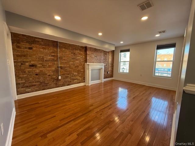 1 South Hamilton Street, Unit 3 Poughkeepsie, NY 12601 - Photo 6 of 17 a view of an empty room with a window and wooden floor