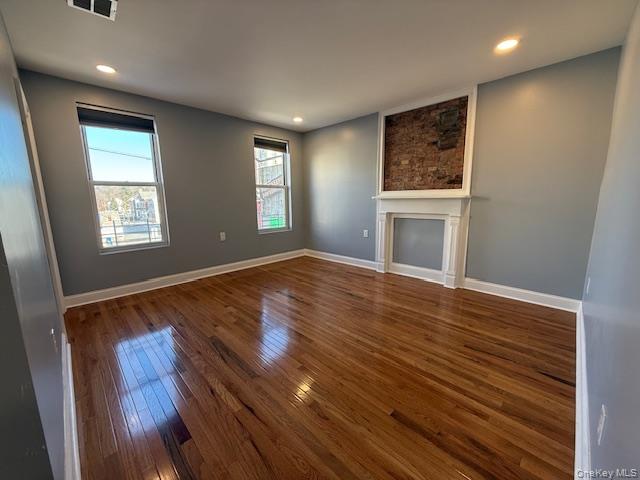 1 South Hamilton Street, Unit 3 Poughkeepsie, NY 12601 - Photo 7 of 17 a view of an empty room with wooden floor and a window
