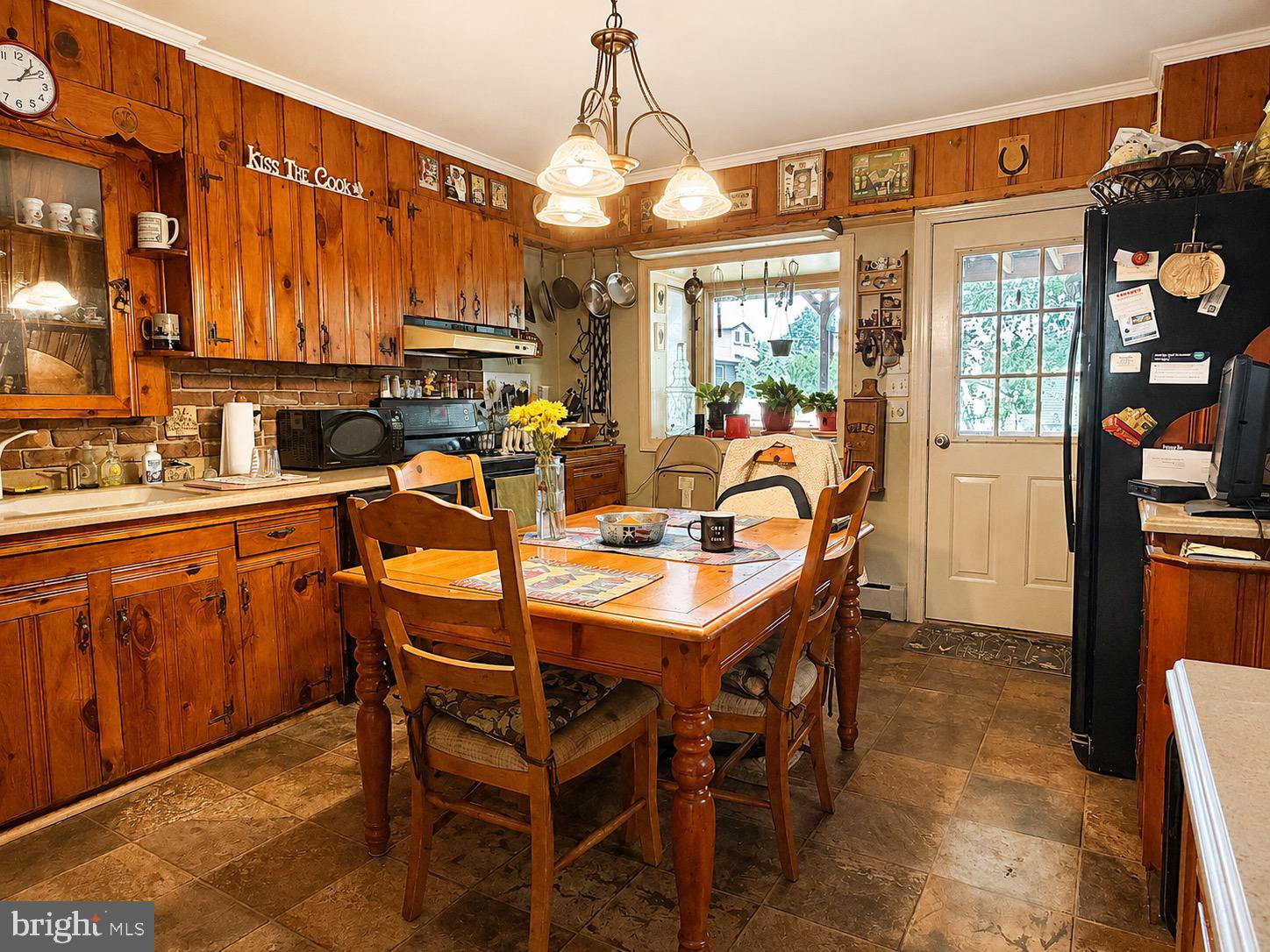 923 Rosa Avenue Croydon, PA 19021 - Photo 11 of 26 a dining room with a wooden table and chairs