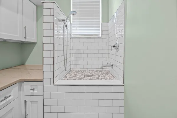 a bathroom with a granite countertop sink mirror and