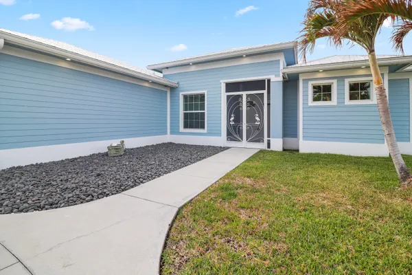 a view of a house with a garden