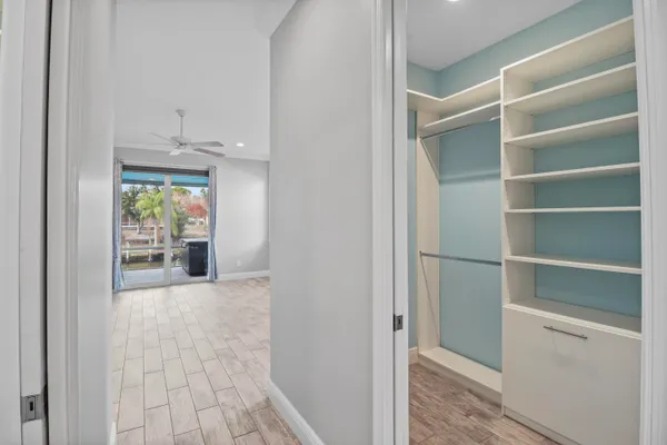 a bathroom with a granite countertop sink a toilet and a mirror