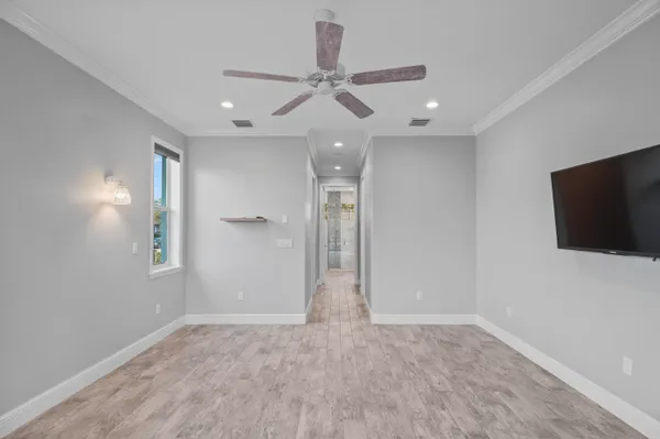 a view of walk in closet with empty racks