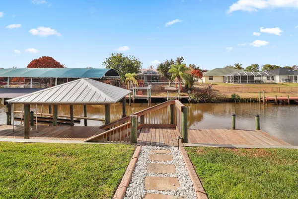 an aerial view of a house with outdoor space