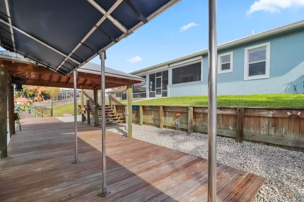 a view of living room kitchen and entryway