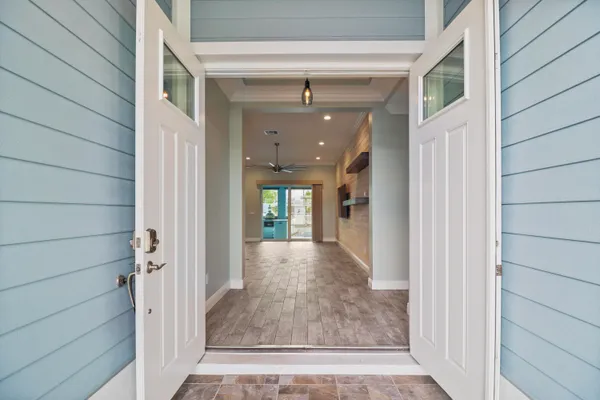 a view of a kitchen with a sink and a window