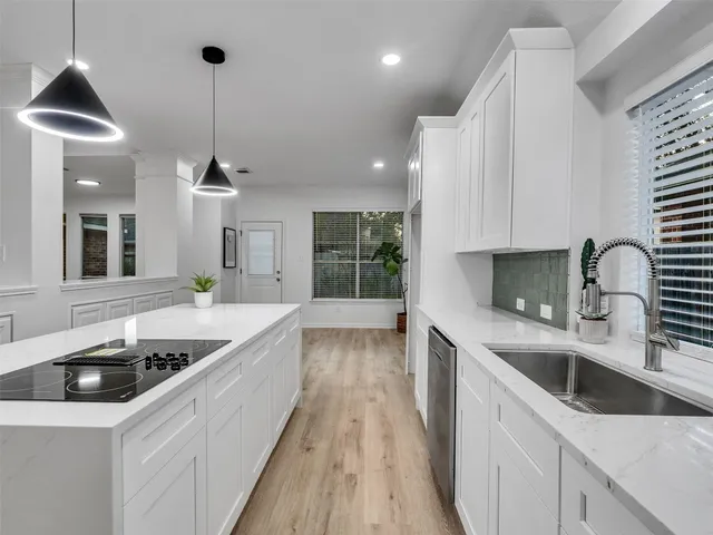 a kitchen with a sink and stove