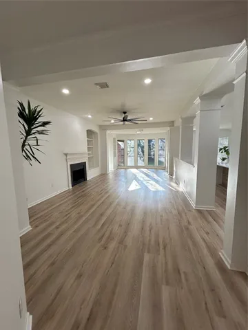 a view of livingroom with hardwood floor and a ceiling fan